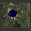 Detailed Terrain Aerial View Featuring Central Blue Lake And Green Surrounding Areas