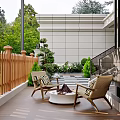 Garden Landscape With Outdoor Patio Wooden Fence Rattan Chairs Fire Pit And Green Plants
