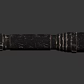 Damaged Black Carbon Fiber Flashlight With Textured Surface And Metal Rings On Reflective Base