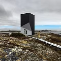 Modern Black and White Unique Structure Detached Villa in Wild Grass with Distant Islands