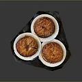 Three Delicious Baked Puff Pastry Tarts Displayed On White Plates Over Dark Tray