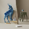 Origami Deer Shaped Blue Green Bookcase With White Cylindrical Decor Plants And Small Blue Statue