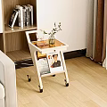 Modern Wheeled Side Table With Potted Plant And Magazines In Living Room