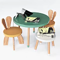 Green Round Kids Table with Rabbit Ear Chairs Table Lamp and Books