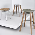 Three Modern Bar Stools Featuring Wooden Seats And Metal Frames On White Platform 3d model
