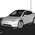 White Tesla Model Y SUV With Modern Exterior Black Roof And Alloy Wheels On Road