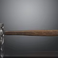 Claw Hammer with Metal Head and Wooden Handle on Black Smooth Surface and Reflection