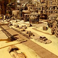 Futuristic Industrial Landscape With Large Mechanical Structures Multi Level Buildings And Vehicle Wrecks