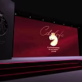 Elegant Event Venue Setup With Red Stage Backdrop Cafe Logo And Dining Tables