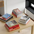 Stacks of Colorful Books and Magazines On Wooden Table With Various Covers and Genres