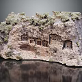 Natural Rock Formation With Carved Ancient Buildings And Mossy Surface Displaying Historical Artistry