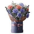 Blue Vase With Pink Ribbon Holding Orange Blue White Flowers And Green Leaves