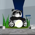 Panda Themed Photo Check In Spot with Green Bamboo Plants and Illuminated Signposts at Night