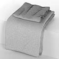 Folded Striped Towel With Gray Brown Black Stripes On White Surface
