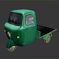 Green Three Wheeled Cargo Truck With Flatbed And Classic Vintage Design