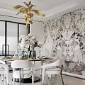 Elegant Restaurant with Round Dining Table White Chairs Marble Wall Golden Chandelier and White Orchids