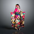 Woman Wearing Colorful Kimono With Floral Patterns Standing Against Gray Background