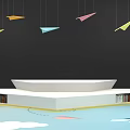 Colorful Paper Planes Hanging Over White Blue Platforms With Small Umbrella And Chairs