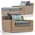 Comfortable Wicker Outdoor Sofa with Soft Gray Cushions and Striped Pillows