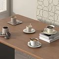 Coffee Cups On White Saucers Over Wooden Table With Stack Of Books And Geometric Art