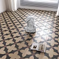 Black And White Floral Pattern Floor Tiles With White Statue And Open Book