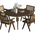 Wooden Round Dining Table Set With Rattan Chairs Decorative Vase Books And Fruit Bowl