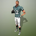 Man In Green Football Jersey With Number 12 Holding Helmet And White Pants