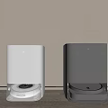 Two Modern Robot Vacuums With Charging Docks In White And Gray 3d model