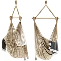 Natural Woven Hanging Chair Design With Cozy Blanket And Fringe Details