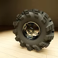 Off Road Tire With Deep Tread Pattern And Shiny Metallic Alloy Wheel Design