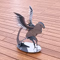 Metal Bird Sculpture with Spread Wings on Metal Base and Wooden Floor