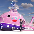 Colorful Pink Purple Whale Shaped Play Structure with Slide and Children Playing in Park