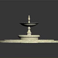 Multi Tiered Circular Fountain Design With Blue Water And Light Colored Edges