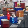 Colorful Catering Food Buffet Display With Assorted Desserts Cake Macarons Donuts And Coffee Cups