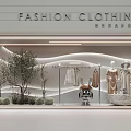 Fashion Clothing Store Window Display With Mannequins Plants And Modern Design