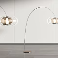 Modern Arched Floor Lamp with Glass Shade and Metal Stand in Living Room