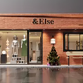 Stylish Red Brick Clothing Store With Exquisite Mannequin Window Display And Comfortable Outdoor Bench
