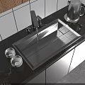 Stainless Steel Kitchen Sink With Faucet On Dark Marble Countertop And White Small Bowls