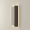 Modern Cylindrical Wall Lamps in White and Dark Brown Illuminated on Beige Wall
