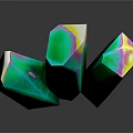 Polished Black Stone Surface Displaying Green Crystals With Colorful Tips