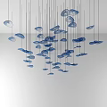 Blue Disc Shaped Chandeliers Hanging In Irregular Arrangement On White Background