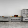 Stainless Steel Kitchen Setup With Counter Shelf Appliances And Bottles