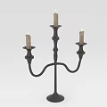 Elegant Black Candelabra Featuring Three Lit Candles And Curved Stand Design
