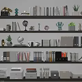 Organized Office Bookshelf With Books Green Plants Decorative Items And Office Supplies