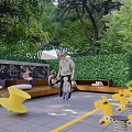 Residential Landscape Design With Lush Trees Benches and Relaxing Paved Area