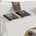 Elegant Black Brown Hardcover Books With Decorative Patterns On White Table 3d model