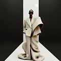 Woman Wearing Sunglasses In Beige Oversized Coat With Dramatic Structural Design On Minimalist Runway