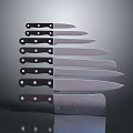 Different Sizes Kitchen Knives With Black Handles And Silver Blades For Cooking