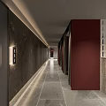 Modern Public Restroom Corridor With Dark Walls And Stone Flooring