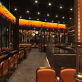 Modern Upscale Restaurant Interior With Warm Ambient Lighting Complete Bar And Comfortable Dining Seats